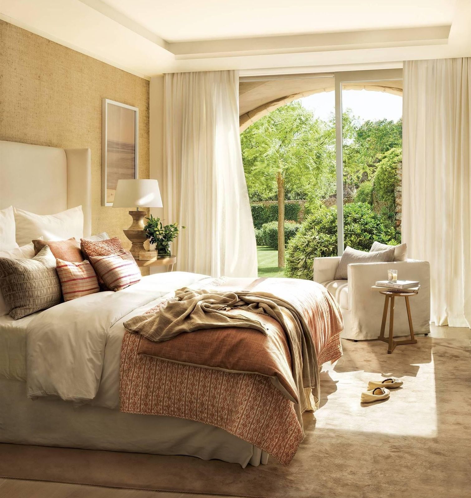 Comfortable family garden room with arched glazed doors